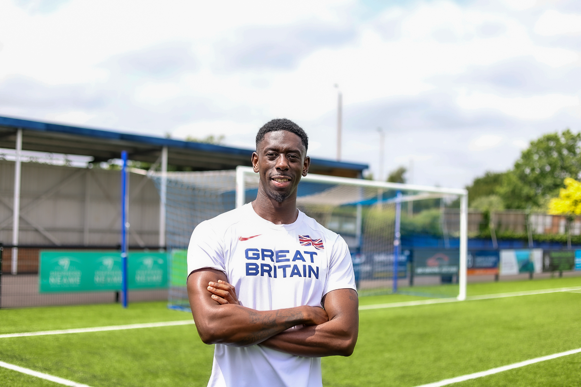Coach in Great Britain kit on the track